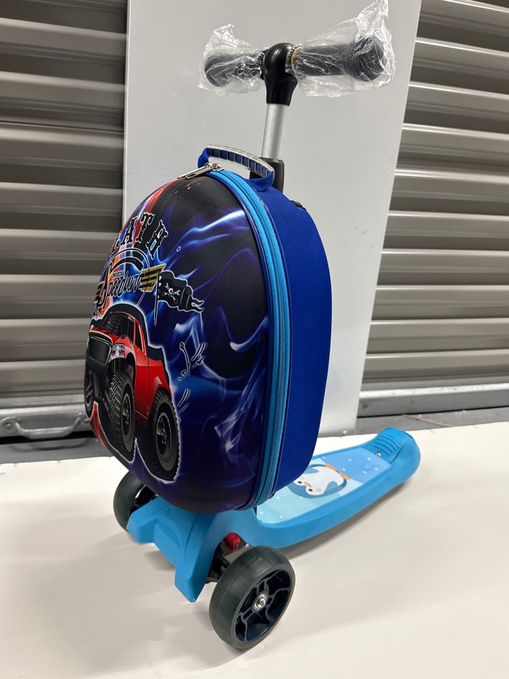 Kids Blue Ride-On Scooter with Red Monster Truck Backpack
